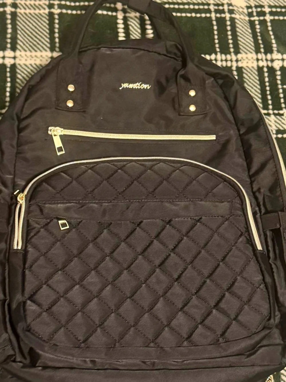 Black Quilted Backpack with Gold Accents